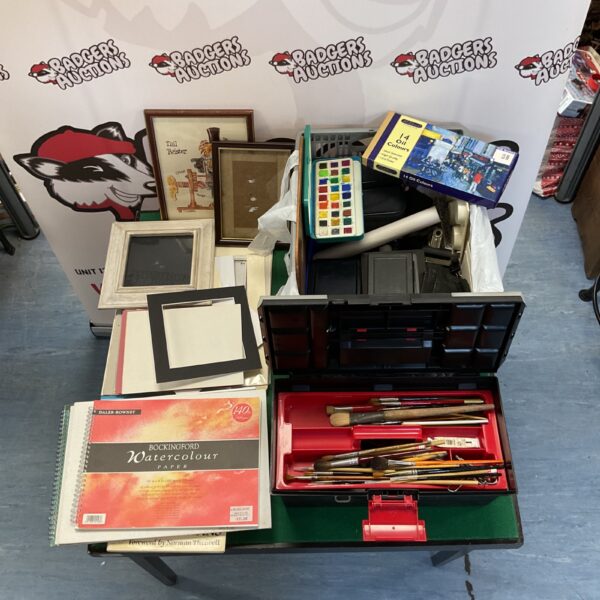 Large lot of artist materials including paints, sketchbooks and easel.