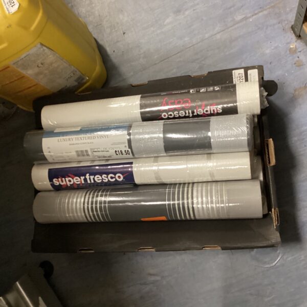 Assorted wallpaper rolls in a mixed lot for home decor.