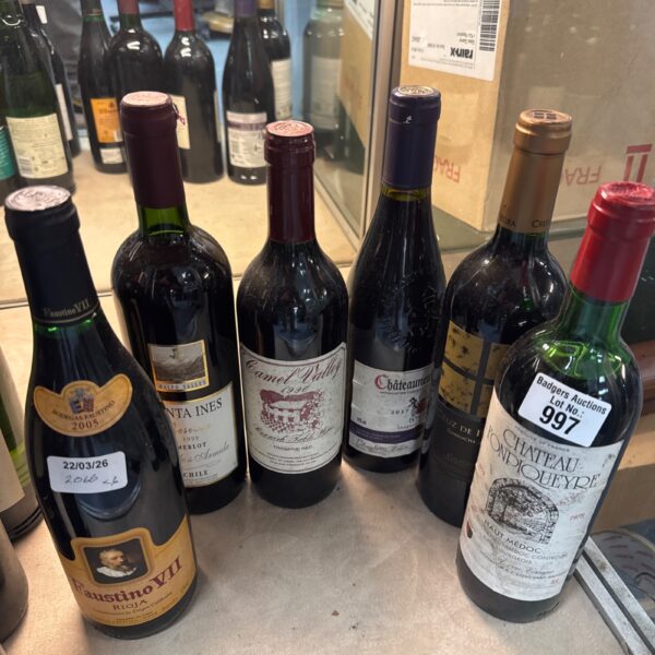 Assorted wine lot featuring bottles from Chile and France.