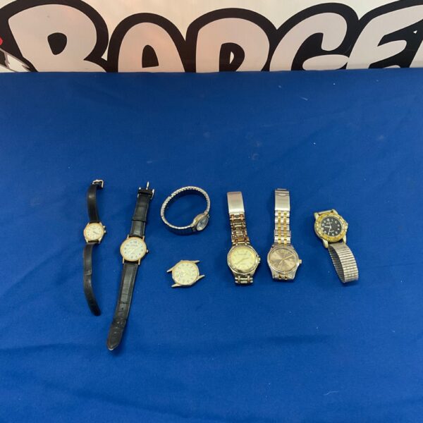 Assorted wristwatches including Sekonda and Citron brands on display.