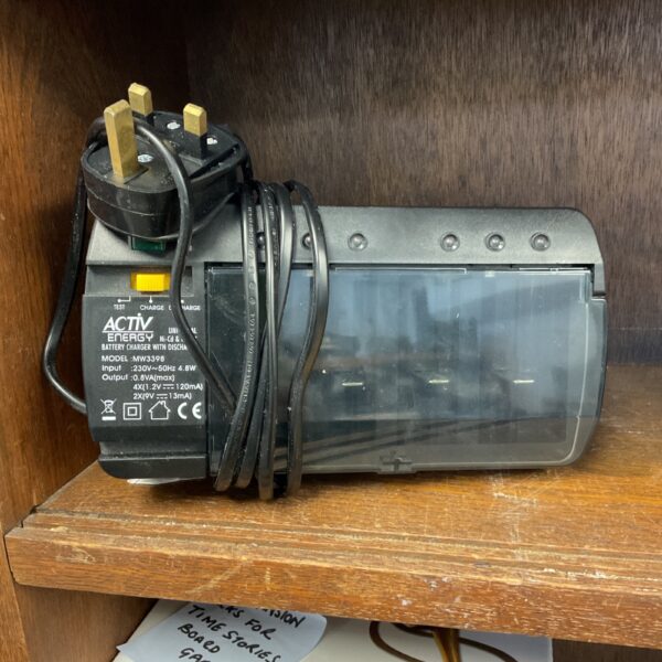 Vintage Avtiv energy battery charger with UK plug and coiled cable.