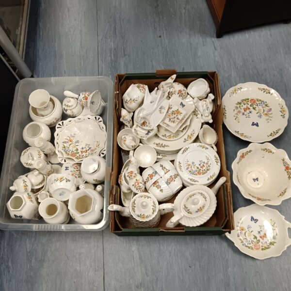 Large collection of vintage Aynsley Cottage Garden china on display.