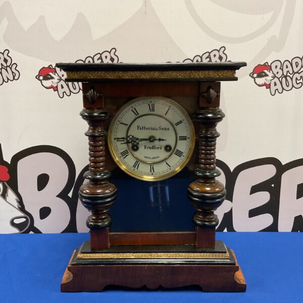 Antique Baden PH&S Fattorini Bradford clock with wooden case.