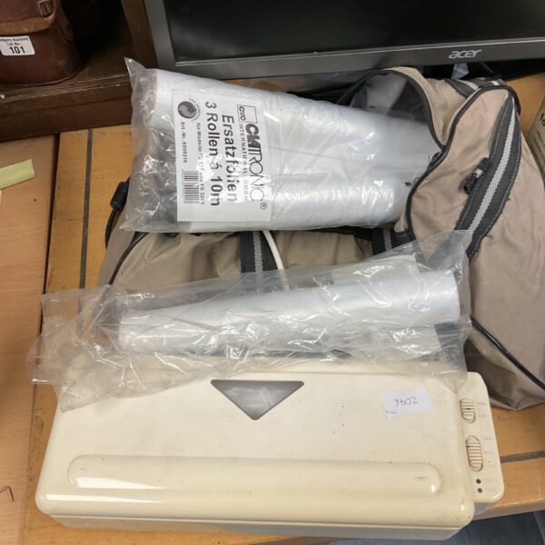 Front view of a vintage bag sealer machine.
