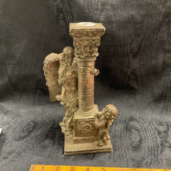 Ornate baroque angel candelabra with cherub base.