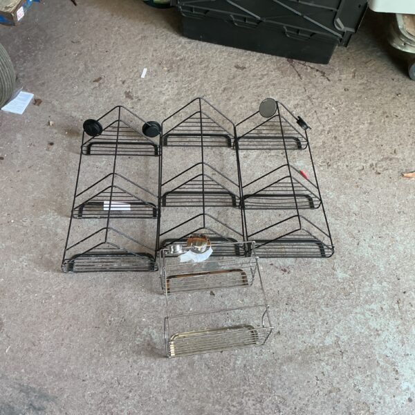 Lot of four metal wire bathroom caddies for storage.