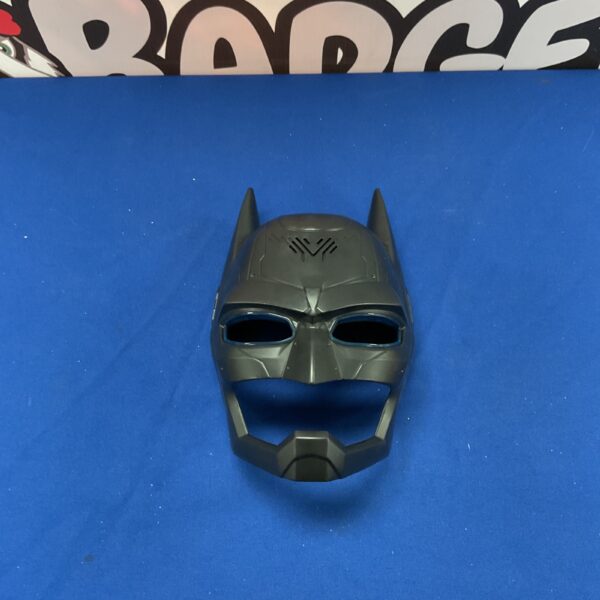 Front view of the black electronic Batman mask.