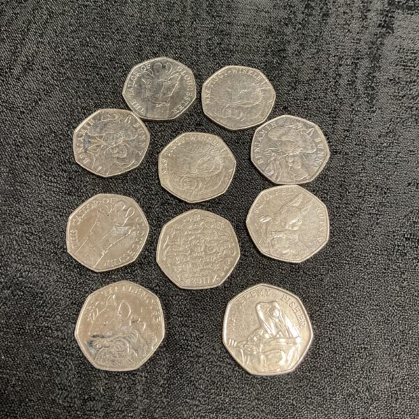 Beatrix Potter 50p coin collection featuring Jeremy Fisher and Mrs Tittlemouse.