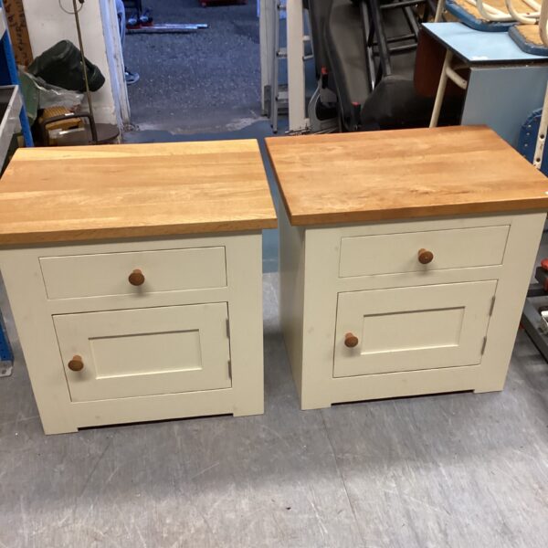 Pair of painted wooden bedside cabinets with single drawers.