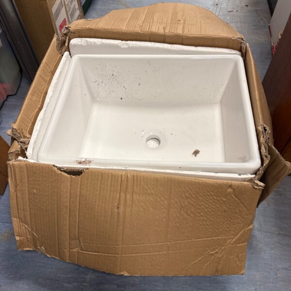 Ceramic Belfast sink in original packaging, ready for installation.