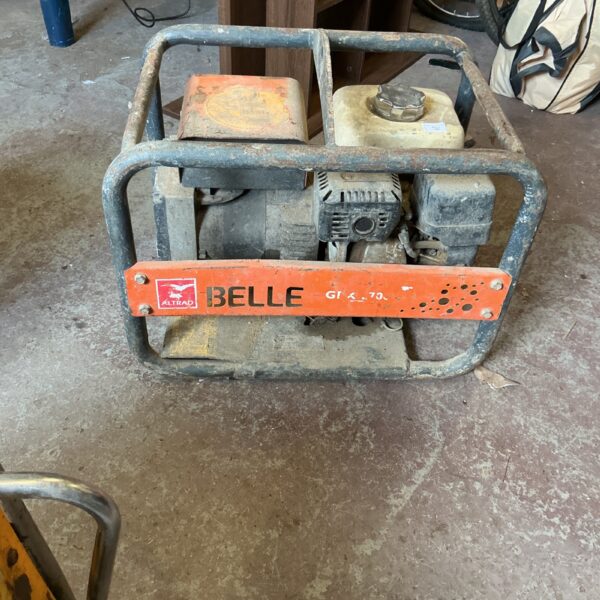 Side view of a vintage Belle petrol generator.