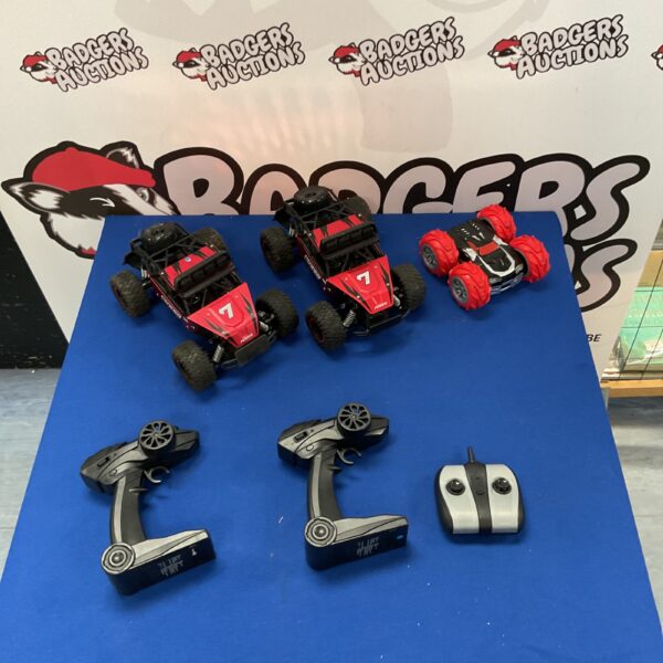 Red and black Bezgar BZR17 RC cars on a blue surface.
