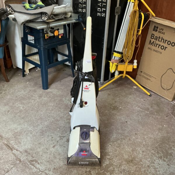 Vintage Bissell carpet cleaner 1395A for home cleaning.