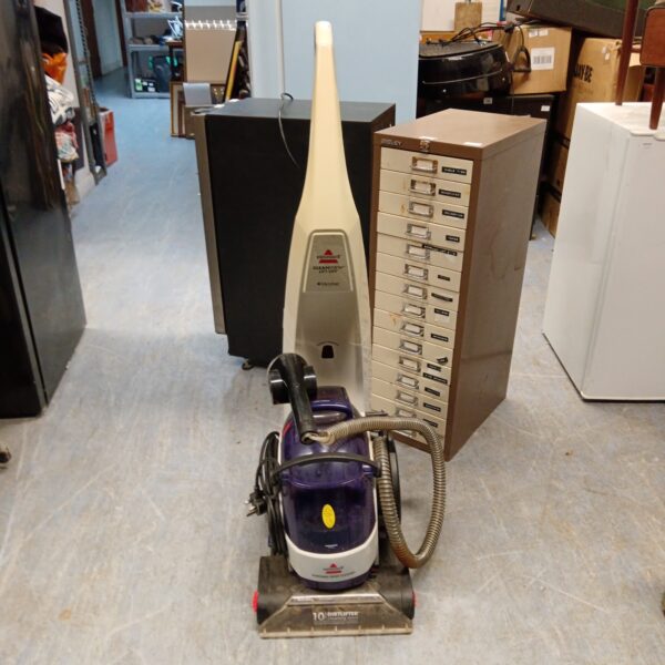 Bissell CleanView Lift Off carpet cleaner with hose attached.