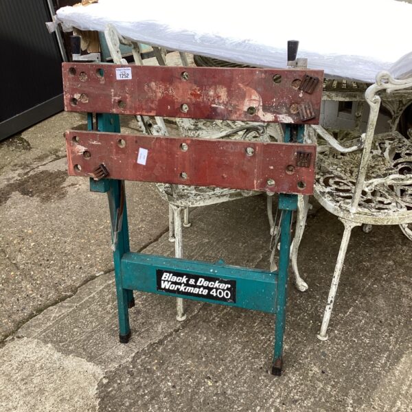 Vintage Black and Decker Workmate 400 workbench in a workshop setting.