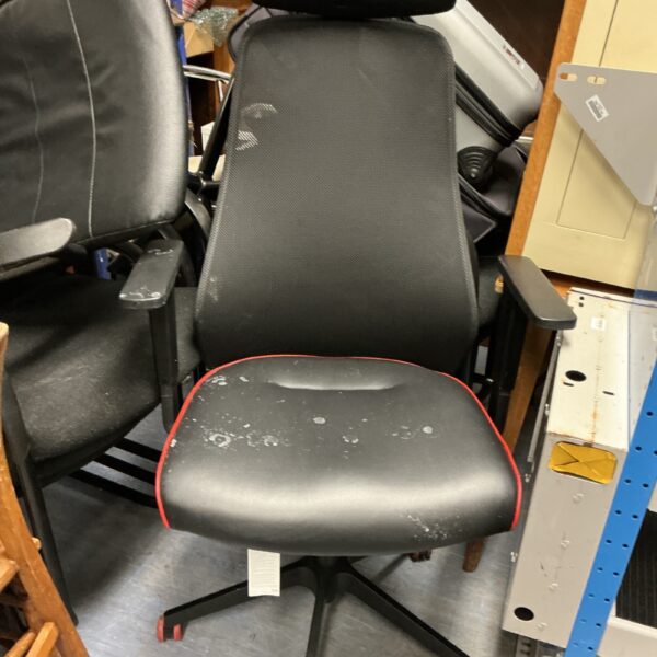 Black mesh office chair with headrest and adjustable height.