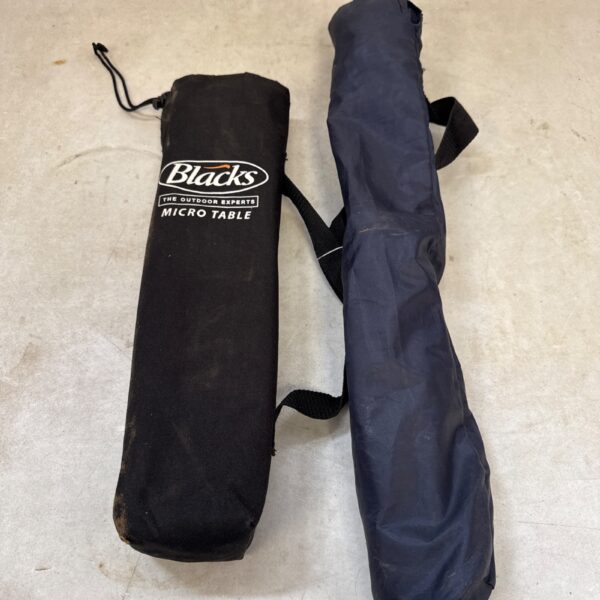 Folded Blacks micro table, lightweight and portable camping solution.