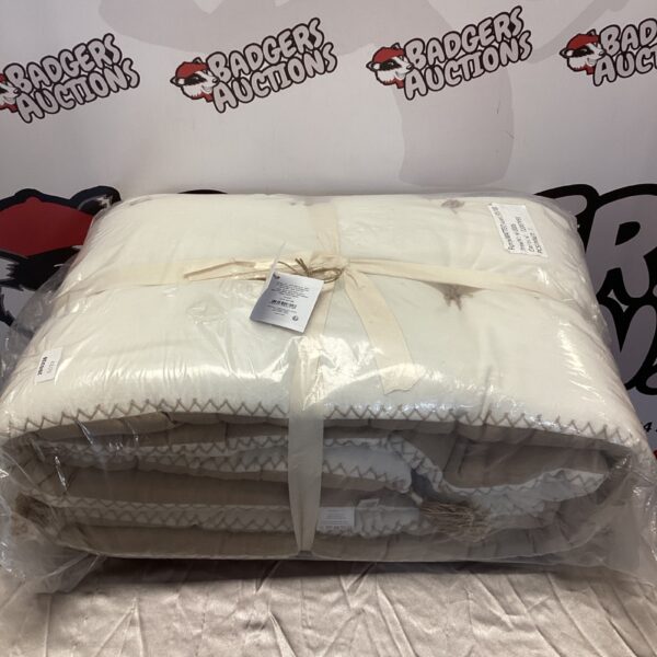 New beige and white Blanc d'voire futon cover in packaging.