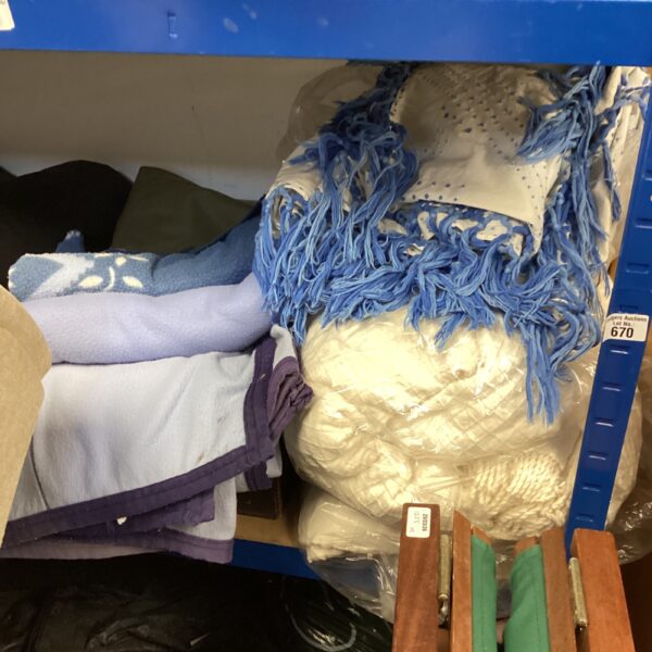 Assorted blankets and throws in a mixed lot, offering cozy home comfort.