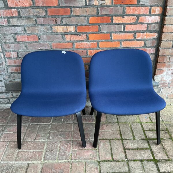 Pair of blue Danish design chairs with wooden frames.