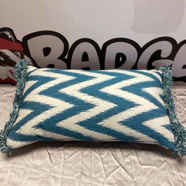 Blue zig zag cushion with tassels for modern home decor.