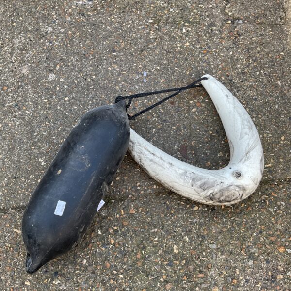 Pair of vintage boat anchor buoys for nautical use.