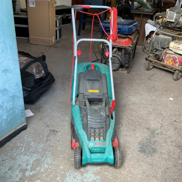 Green Bosch electric lawn mower for garden maintenance.