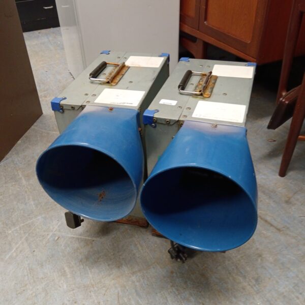 Pair of used bouncy castle blowers on castors.