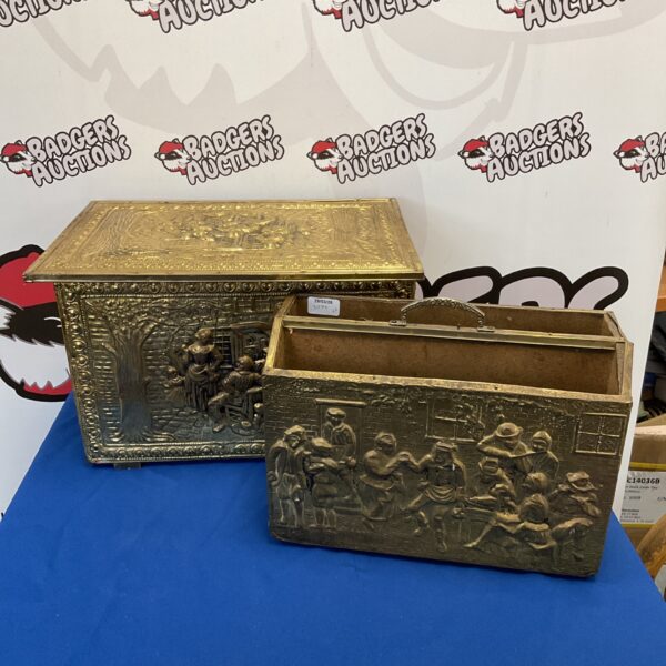 Vintage brass log box with tavern scene detail.