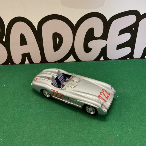Silver Burago Mercedes-Benz 300 SLR diecast model car on display.