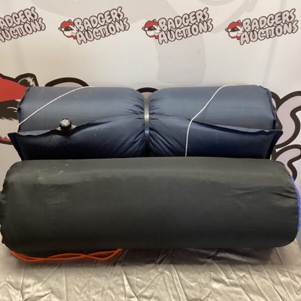 Two rolled camping mats, one Vango branded, ready for outdoor adventures.