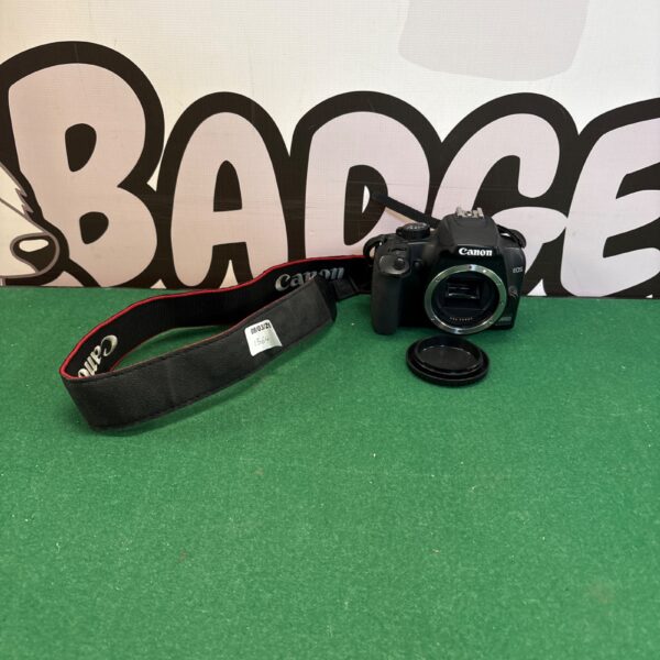 Canon EOS 1000 camera with strap, vintage 35mm film photography.
