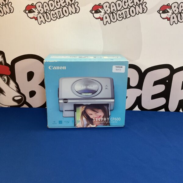 Canon Selphy CP600 compact photo printer in its original box.