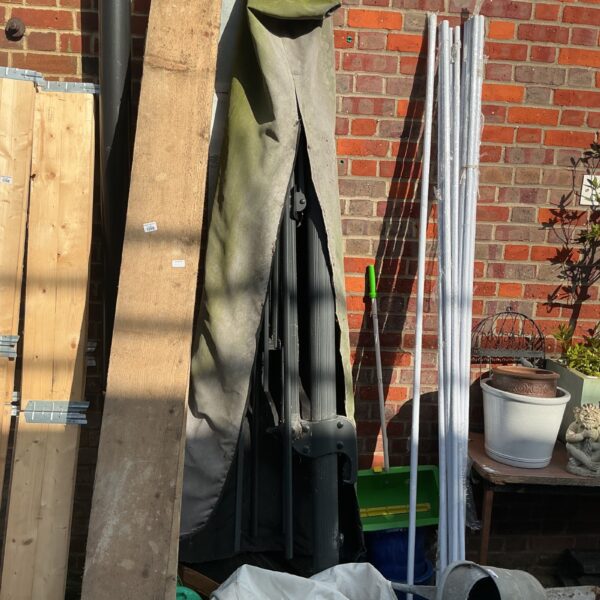 Large cantilever parasol in a garden setting.
