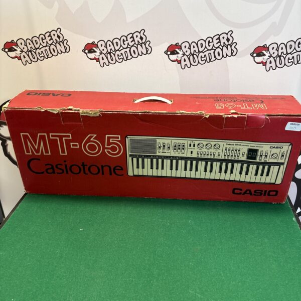 Vintage Casio MT-65 keyboard in its original box.