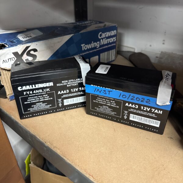 Challenger AA63 12V battery showing voltage readings.