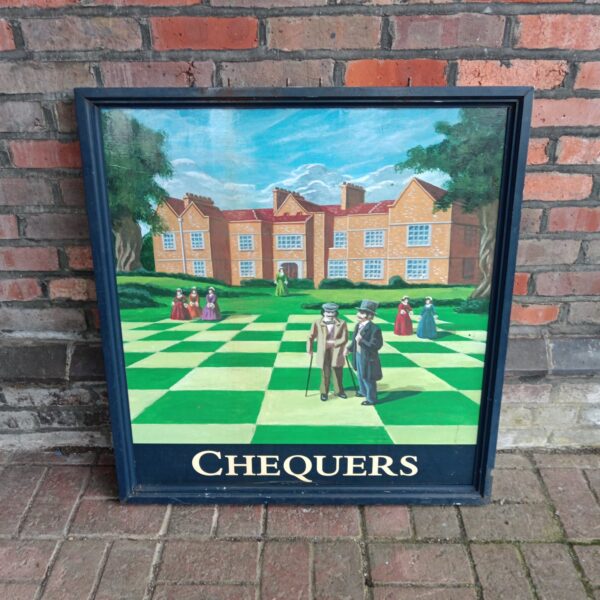 Vintage chequers pub sign with figures on a chequered ground.