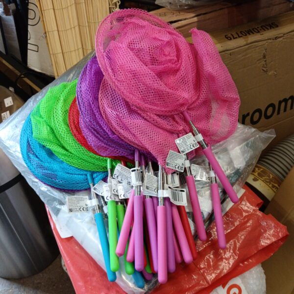 Brightly coloured childrens extending butterfly nets in a lot.