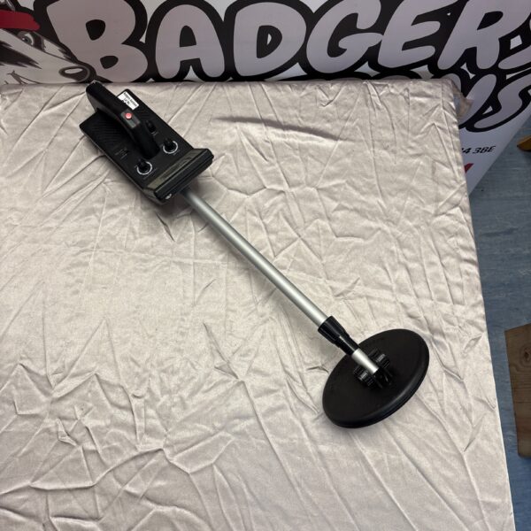 Vintage child’s metal detector toy for outdoor treasure hunting.