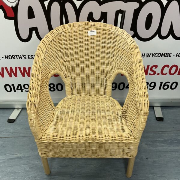 Vintage child's wicker chair with woven seat and back.