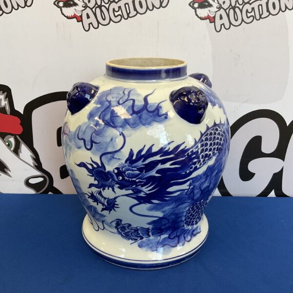 Detailed blue and white Chinese porcelain dragon vase for collectors.