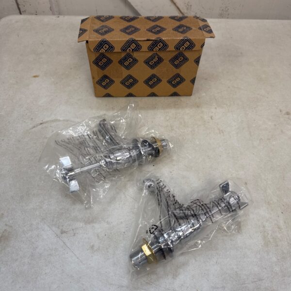 Pair of vintage chrome basin taps for bathroom renovation.