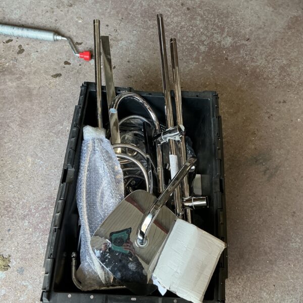 Chrome shower fittings lot for bathroom renovation or repair.