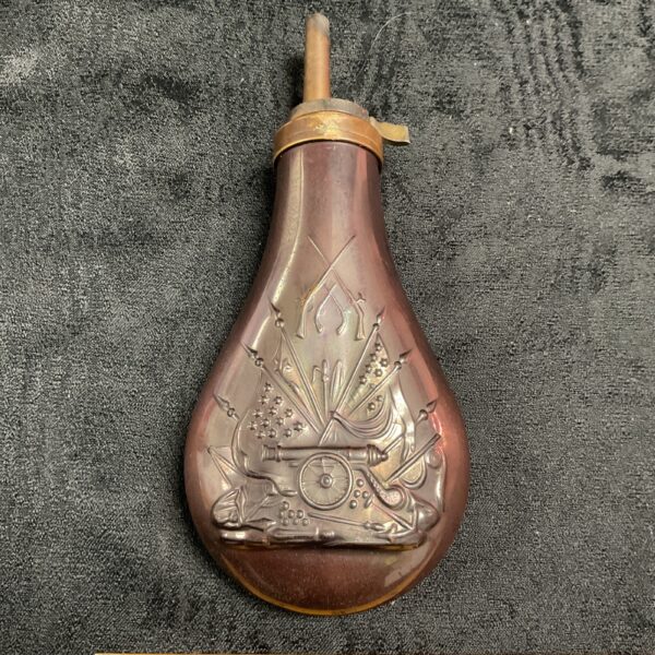 Antique style Civil War copper powder flask with embossed details.