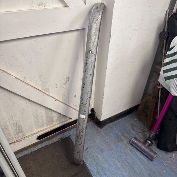Vintage chrome classic car bumper with flaking paint.