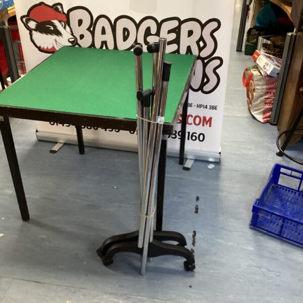 Chrome and plastic clothes rail for garment display.