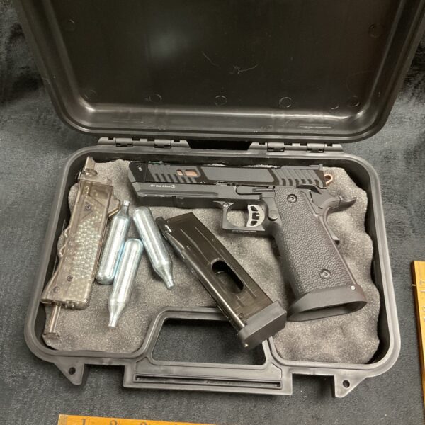 Unbranded CO2 air pistol in a hard case with magazines and cylinders.