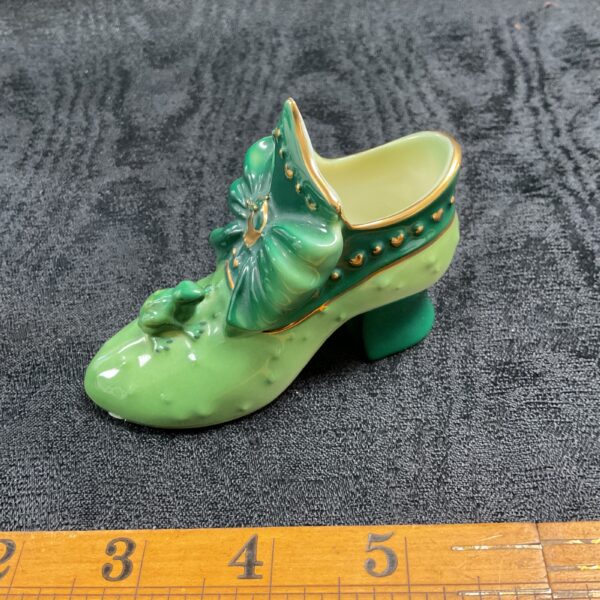 Green Coalport Frog Prince shoe with gold details, side view.