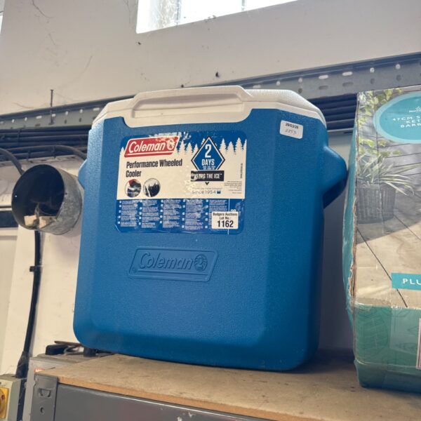 Blue Coleman performance wheeled cooler for outdoor use.