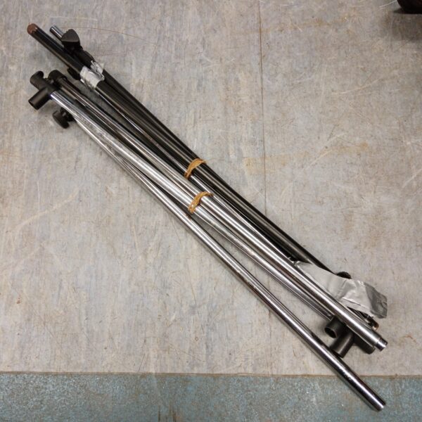 Metal collapsible clothes rail for portable garment storage.